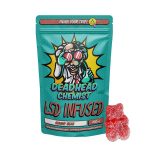 Deadhead Chemist LSD infused gummy bear pouch in teal standing beside a sugar-coated red gummy bear