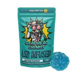 Deadhead Chemist LSD infused gummy bear pouch in teal standing beside a sugar-coated red gummy bear