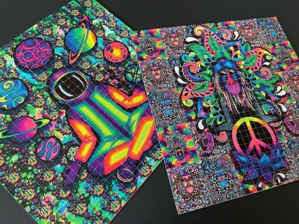 Grid of perforated cotton buy LSD blotter paper tabs printed with vibrant visionary artwork on a clean laboratory surface